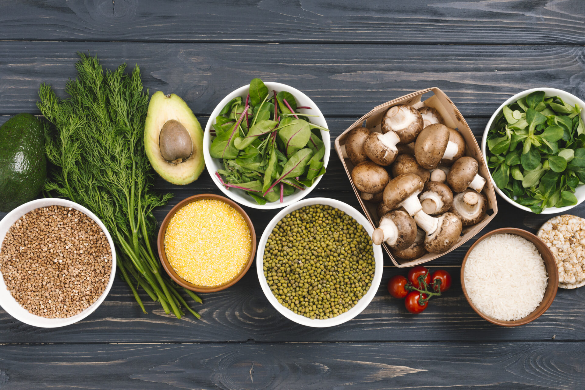 elevated-view-fresh-vegetables-pulses-black-wooden-desk